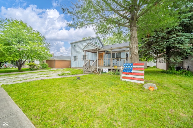 450 Columbia Ave, Tipton, IN 46072 - view of front of home with a front yard and central AC unit