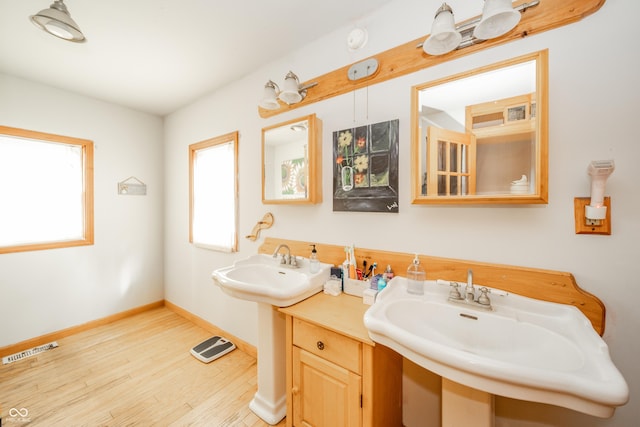 450 Columbia Ave, Tipton, IN 46072 - bathroom with wood finished floors, baseboards, and a sink