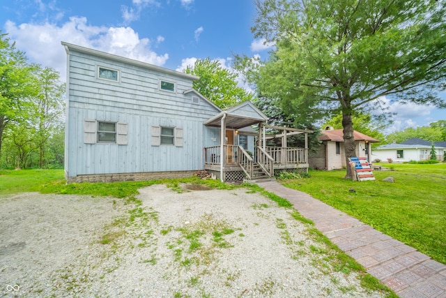 450 Columbia Ave, Tipton, IN 46072 - back of property featuring a lawn and a wooden deck