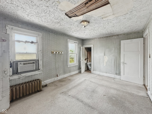 4715 E New York St, Indianapolis, IN 46201 - unfurnished bedroom with radiator heating unit, carpet, and cooling unit