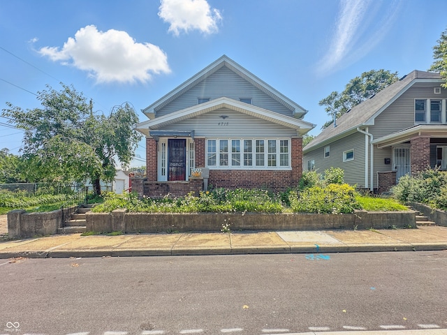 4715 E New York St, Indianapolis, IN 46201 - view of front of home featuring brick siding