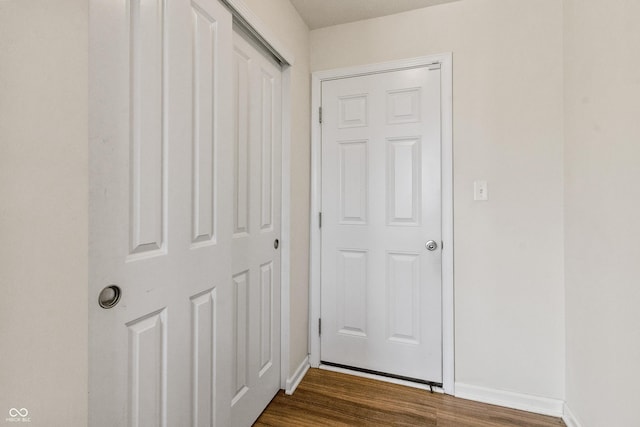 10112 Gallop Ln, Fishers, IN 46040 - hall with dark wood-type flooring and baseboards