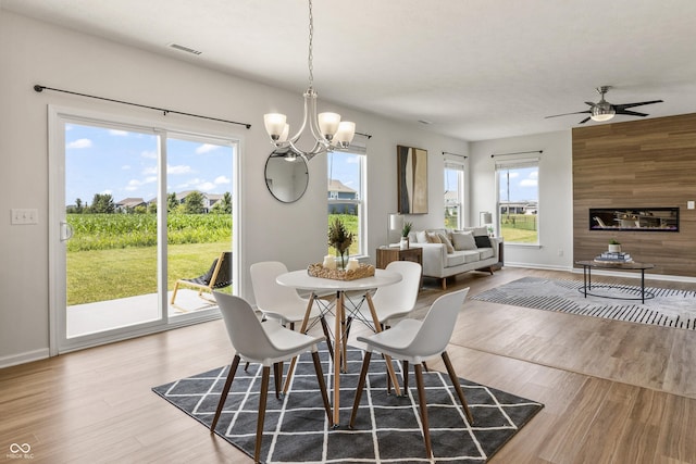 10112 Gallop Ln, Fishers, IN 46040 - dining room with a chandelier, wood finished floors, and ceiling fan