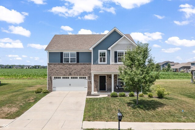 10112 Gallop Ln, Fishers, IN 46040 - traditional-style house featuring concrete driveway, an attached garage, brick siding, and a front yard