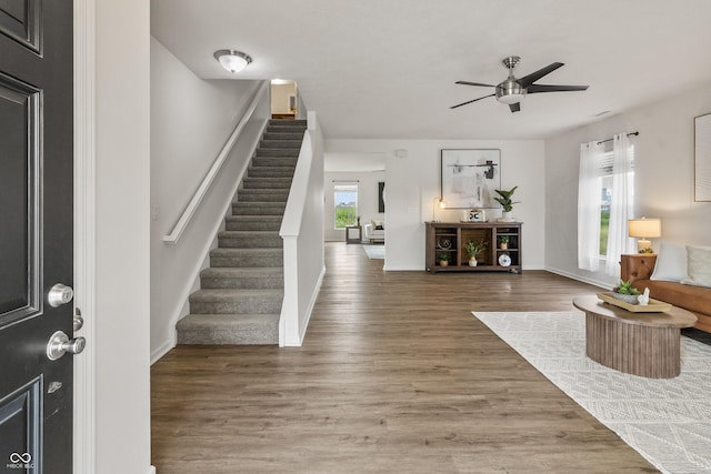 10112 Gallop Ln, Fishers, IN 46040 - entrance foyer featuring stairs, a ceiling fan, and wood finished floors