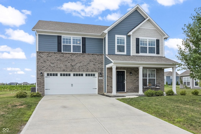 10112 Gallop Ln, Fishers, IN 46040 - view of front facade featuring a front yard, brick siding, an attached garage, driveway, and a porch