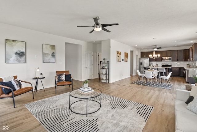 10112 Gallop Ln, Fishers, IN 46040 - living area with a ceiling fan, light wood-style floors, and recessed lighting