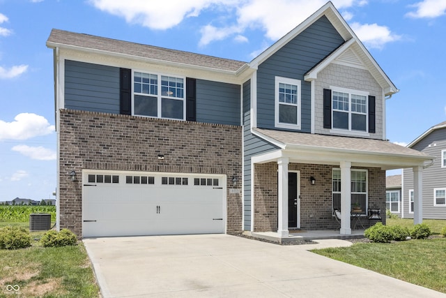 10112 Gallop Ln, Fishers, IN 46040 - view of front of property featuring a garage, brick siding, a porch, and driveway