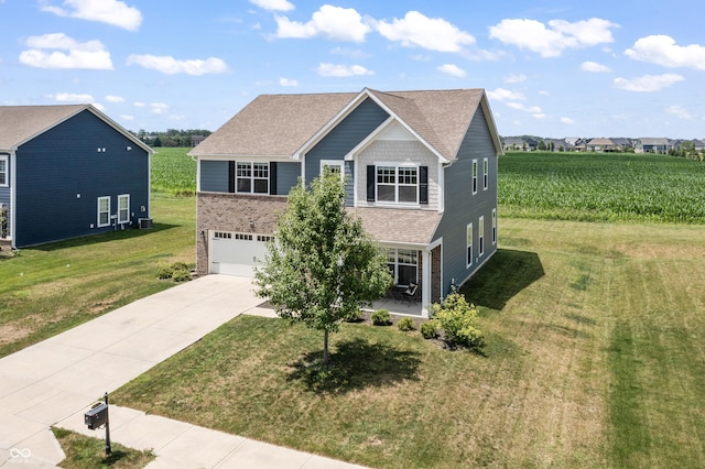 10112 Gallop Ln, Fishers, IN 46040 - view of front facade with concrete driveway, a garage, a front lawn, brick siding, and a shingled roof