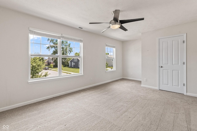10112 Gallop Ln, Fishers, IN 46040 - spare room featuring carpet floors, ceiling fan, and a textured ceiling