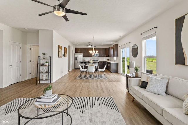 10112 Gallop Ln, Fishers, IN 46040 - living area with a ceiling fan, light wood-style flooring, and recessed lighting