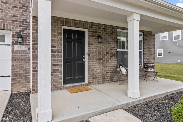 10112 Gallop Ln, Fishers, IN 46040 - view of exterior entry featuring covered porch and brick siding