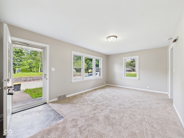 220 Central Ave, Anderson, IN 46012 - empty room with carpet flooring and baseboards