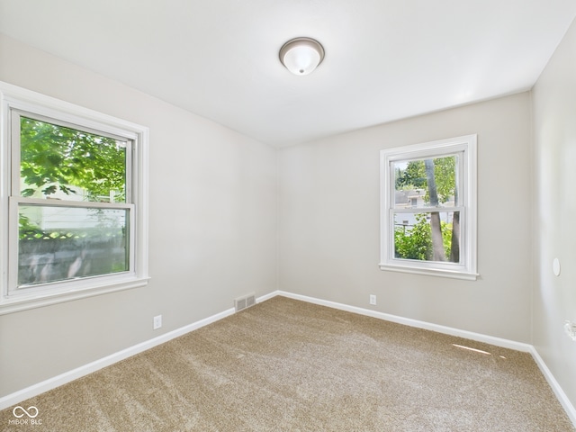 220 Central Ave, Anderson, IN 46012 - empty room with carpet floors and baseboards