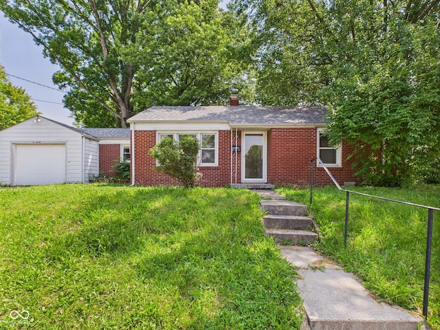 220 Central Ave, Anderson, IN 46012 - ranch-style home with brick siding, a front yard, and a chimney