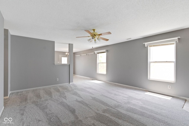 3423 Summer Breeze Cir, Indianapolis, IN 46239 - spare room with a ceiling fan, carpet floors, a textured ceiling, and a chandelier