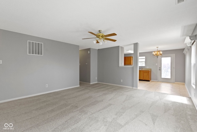 3423 Summer Breeze Cir, Indianapolis, IN 46239 - unfurnished living room featuring a chandelier, light carpet, and ceiling fan