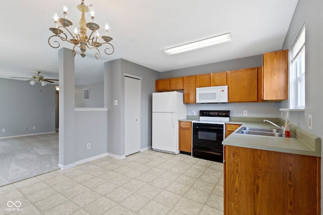 3423 Summer Breeze Cir, Indianapolis, IN 46239 - kitchen with white appliances, brown cabinets, light countertops, and light floors