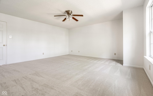 10216 Hatherley Way, Fishers, IN 46037 - spare room with light colored carpet, a ceiling fan, and a textured ceiling
