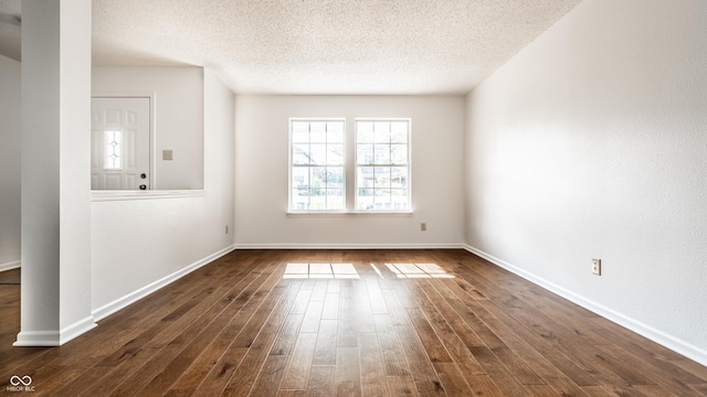 10216 Hatherley Way, Fishers, IN 46037 - spare room featuring a textured ceiling and dark wood-type flooring