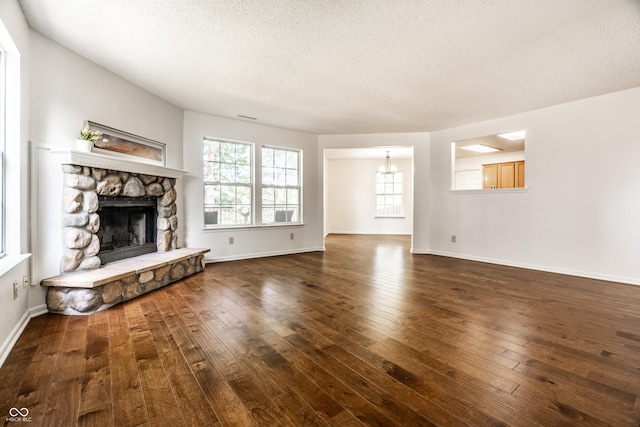 10216 Hatherley Way, Fishers, IN 46037 - unfurnished living room with a fireplace, a textured ceiling, and hardwood / wood-style floors