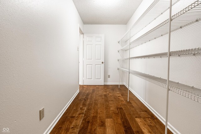 10216 Hatherley Way, Fishers, IN 46037 - corridor with hardwood / wood-style floors, a textured ceiling, and a textured wall