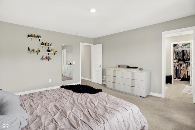 741 Scarsdale Ln, Danville, IN 46122 - bedroom featuring light carpet, a spacious closet, and recessed lighting