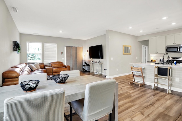 741 Scarsdale Ln, Danville, IN 46122 - dining room with light wood-style flooring and recessed lighting