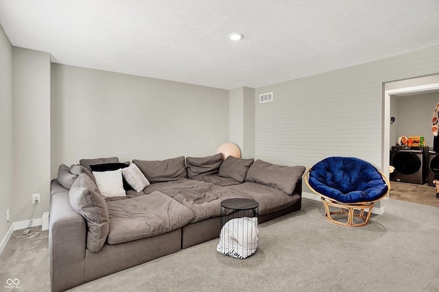 741 Scarsdale Ln, Danville, IN 46122 - carpeted living area featuring washing machine and dryer and baseboards