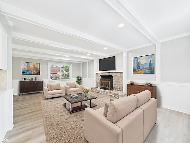 2126 Tartan Rd, Anderson, IN 46012 - living area featuring light wood-style flooring, beam ceiling, wainscoting, and a decorative wall