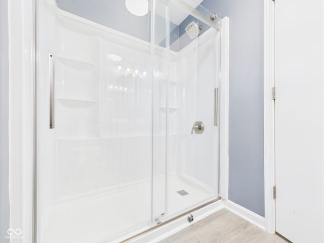 2126 Tartan Rd, Anderson, IN 46012 - full bathroom featuring a shower stall and wood finished floors