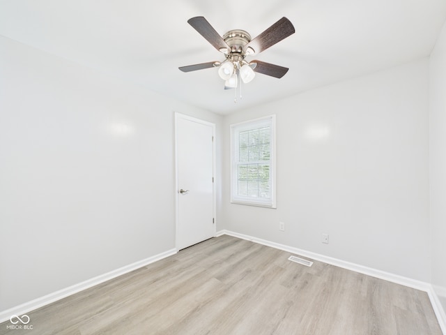 2126 Tartan Rd, Anderson, IN 46012 - empty room with light wood-style flooring and ceiling fan