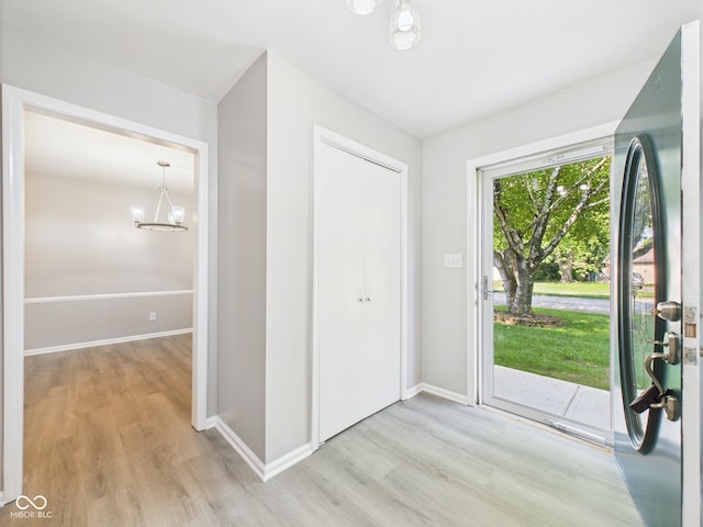2126 Tartan Rd, Anderson, IN 46012 - foyer featuring wood finished floors and a chandelier