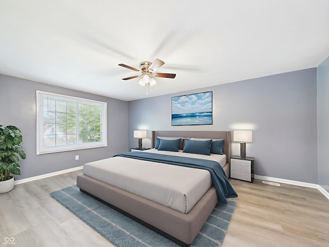 2126 Tartan Rd, Anderson, IN 46012 - bedroom featuring light wood-style flooring and a ceiling fan
