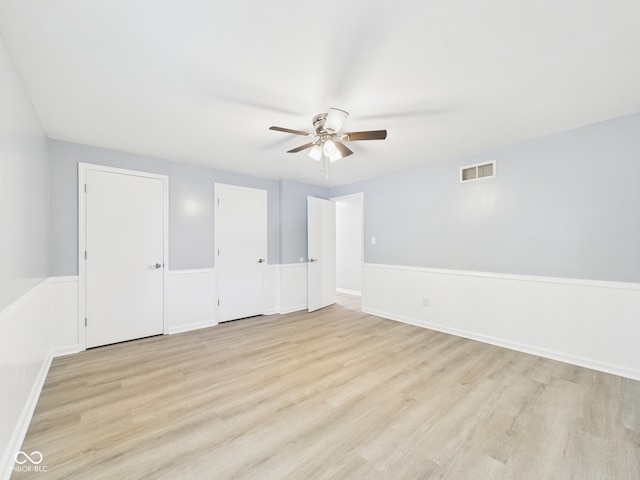 2126 Tartan Rd, Anderson, IN 46012 - unfurnished bedroom with light wood finished floors and a ceiling fan
