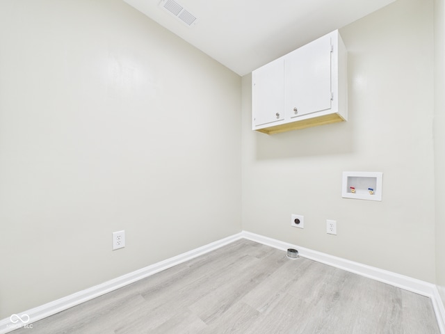 2126 Tartan Rd, Anderson, IN 46012 - washroom with cabinet space, washer hookup, light wood-style flooring, and hookup for an electric dryer