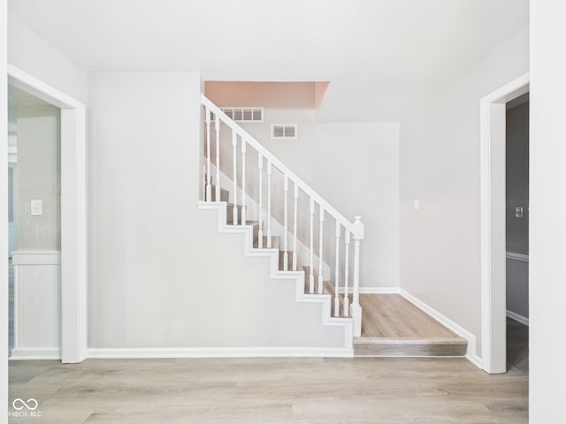 2126 Tartan Rd, Anderson, IN 46012 - stairway with wood finished floors and baseboards
