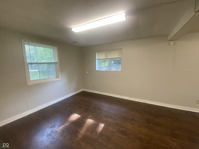 667 E Edgewood Ave, Indianapolis, IN 46227 - empty room featuring dark wood-style flooring and baseboards