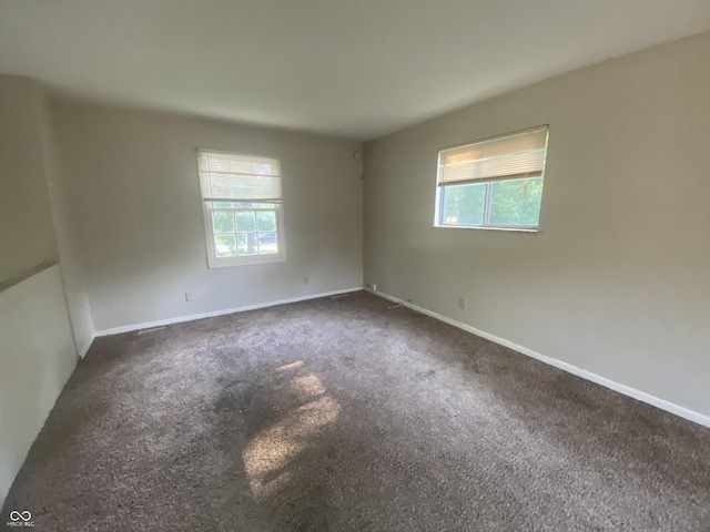 667 E Edgewood Ave, Indianapolis, IN 46227 - unfurnished room with healthy amount of natural light and carpet flooring