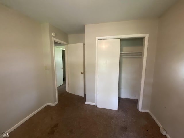 667 E Edgewood Ave, Indianapolis, IN 46227 - unfurnished bedroom featuring a closet and carpet flooring
