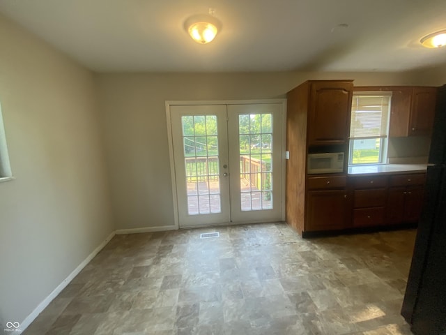 667 E Edgewood Ave, Indianapolis, IN 46227 - entryway featuring french doors and stone finish floors