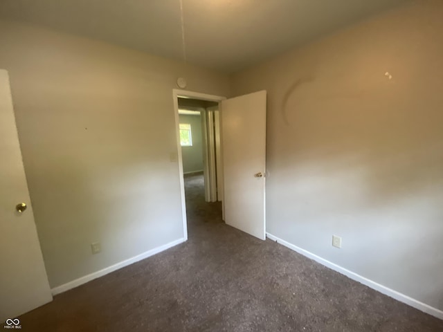 667 E Edgewood Ave, Indianapolis, IN 46227 - unfurnished bedroom featuring carpet floors and baseboards