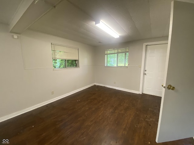 667 E Edgewood Ave, Indianapolis, IN 46227 - spare room featuring dark wood-style flooring and baseboards