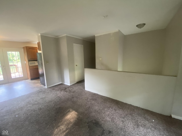 667 E Edgewood Ave, Indianapolis, IN 46227 - carpeted spare room featuring crown molding and baseboards
