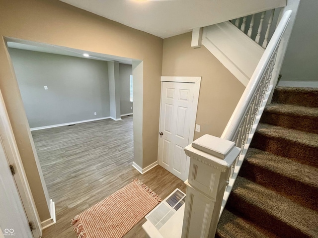 3835 N Kenwood Ave, Indianapolis, IN 46208 - stairs with wood finished floors and baseboards