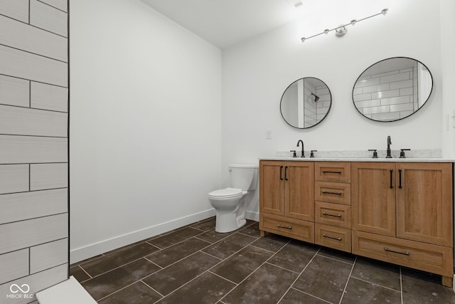 1409 N Grant Ave, Indianapolis, IN 46201 - bathroom with double vanity and toilet