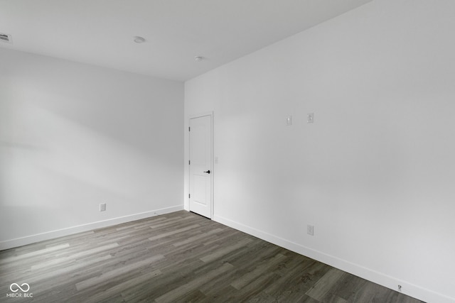 1409 N Grant Ave, Indianapolis, IN 46201 - spare room featuring wood finished floors and baseboards