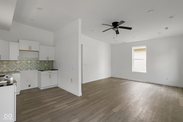 1409 N Grant Ave, Indianapolis, IN 46201 - kitchen featuring tasteful backsplash, wood finished floors, white cabinetry, ceiling fan, and open floor plan