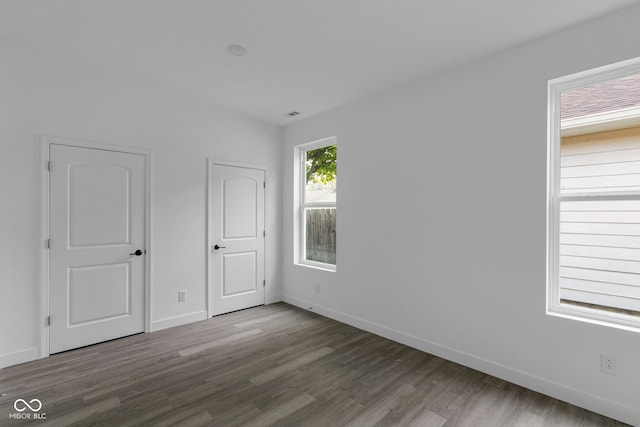 1409 N Grant Ave, Indianapolis, IN 46201 - unfurnished bedroom with wood finished floors and baseboards