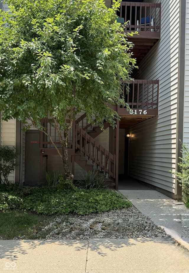 8176 Shorewalk Dr Unit C, Indianapolis, IN 46236 - view of property exterior with a balcony and stairs